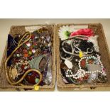 TWO BASKETS OF COSTUME JEWELLERY