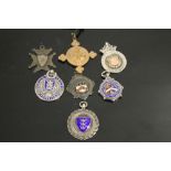 A COLLECTION OF SILVER FOB MEDALS TOGETHER WITH A ST JOHN'S AMBULANCE EXAMPLE
