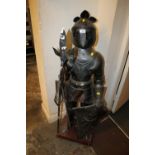 AN UNUSUAL SMALL METAL ARMOURED KNIGHT WITH SWORDS - H 124 CM