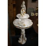 A LARGE WHITE AND GILT PORCELAIN WATER FOUNTAIN WITH FIGURATIVE DETAIL - H 142 CM NOTE: NOT FIXED