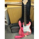 A GEAR4MUSIC PINK ELECTRIC GUITAR WITH AMPLIFIER