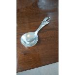 A DANISH SILVER CADDY SPOON, THE FLARED STEM WITH STYLISED SINUOUS FLORAL DECORATION, FIG SHAPE BOWL