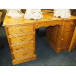 A HONEY PINE TWIN PEDESTAL DESK - H 76 CM, W 137 CM