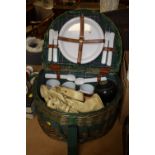 A SEMI-CIRCULAR WICKER PICNIC HAMPER AND CONTENTS TO INC LAWN BOWL