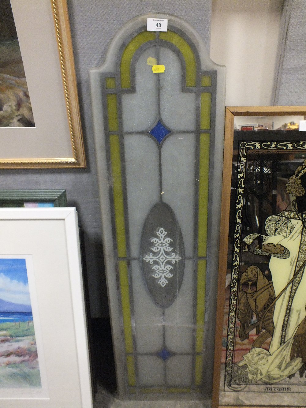 A PAIR OF ARCHED STAIN GLASS WINDOW PANELS