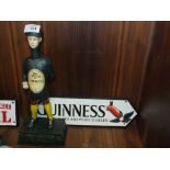 ***A MODERN CAST METAL GUINNESS MONEY BANK TOGETHER WITH A CAST METAL GUINNESS SIGN