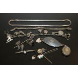 A BAG OF ASSORTED SILVER JEWELLERY ETC. TO INCLUDE A CHARM BRACELET, LOCKET ETC.