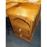 A PINE TWO DRAWER BEDSIDE CABINET