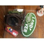 ***A MODERN CAST METAL LAND ROVER BELL AND TWO LAND ROVER PLAQUES