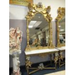 A HUGE GILT MARBLE TOPPED CONSOLE TABLE WITH MIRROR, DECORATED WITH FIGURATIVE CHERUBIC DETAIL - H