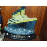 ***A MODERN CAST METAL TITANIC DOOR STOP