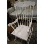 A WHITE PAINTED ROCKING CHAIR