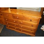 A HONEY PINE NINE DRAWER CHEST - H 91 CM, W 138 CM