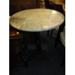 A MARBLE TOPPED TABLE WITH CAST BASE