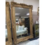 A HUGE GILT MIRROR WITH BEVELLED GLASS 227 cm X 142 cm