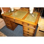 AN OAK REPRODUCTION LEATHER TOPPED TWIN PEDESTAL DESK - H 80 CM, W 138 CM