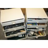 TWO 4 DRAWER WATCH MAKERS CHEST OF DRAWERS CONTAINING WATCH MAKING TOOLS, WATCH PARTS ETC