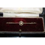 A VICTORIAN 9 CARAT GOLD PEARL AND DIAMOND BAR BROOCH