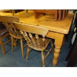 A HONEY PINE KITCHEN TABLE WITH FOUR CHAIRS AND ONE OTHER CHAIR