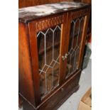 AN OAK GLAZED LEADED BOOKCASE