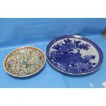 A LARGE BLUE AND WHITE CHARGER TOGETHER WITH ORIENTAL STYLE PLATE