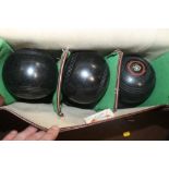 A SET OF BOWLS IN CARRY CASE, (a pair of size 5 Super Grip and 4 Henselite Championship)