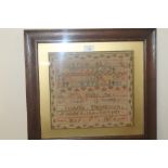 A FRAMED VICTORIAN SAMPLER, "Isabella Thomlinson finished this sampler May 5th 1876", frame size