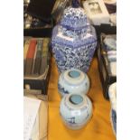 TWO ORIENTAL STYLE GINGER JARS (NO LIDS), TOGETHER WITH A LARGE BLUE AND WHITE LIDDED VASE