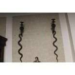 A PAIR OF WALL MOUNTED CANDLE HOLDERS IN THE FORM OF SNAKES