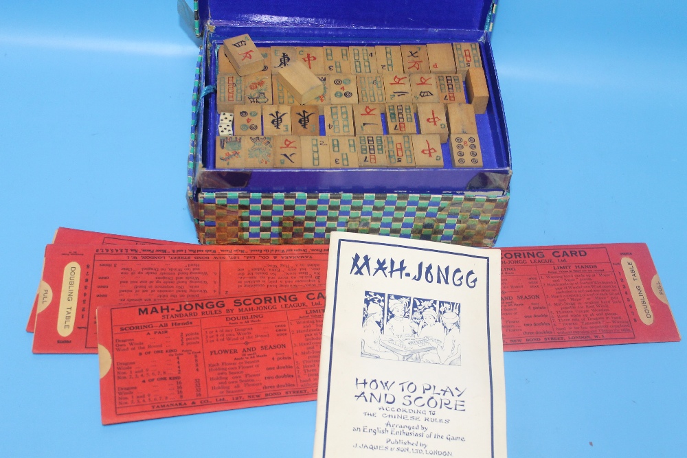 A VINTAGE MAH-JONG SET WITH SCORING CARDS AND INSTRUCTIONS