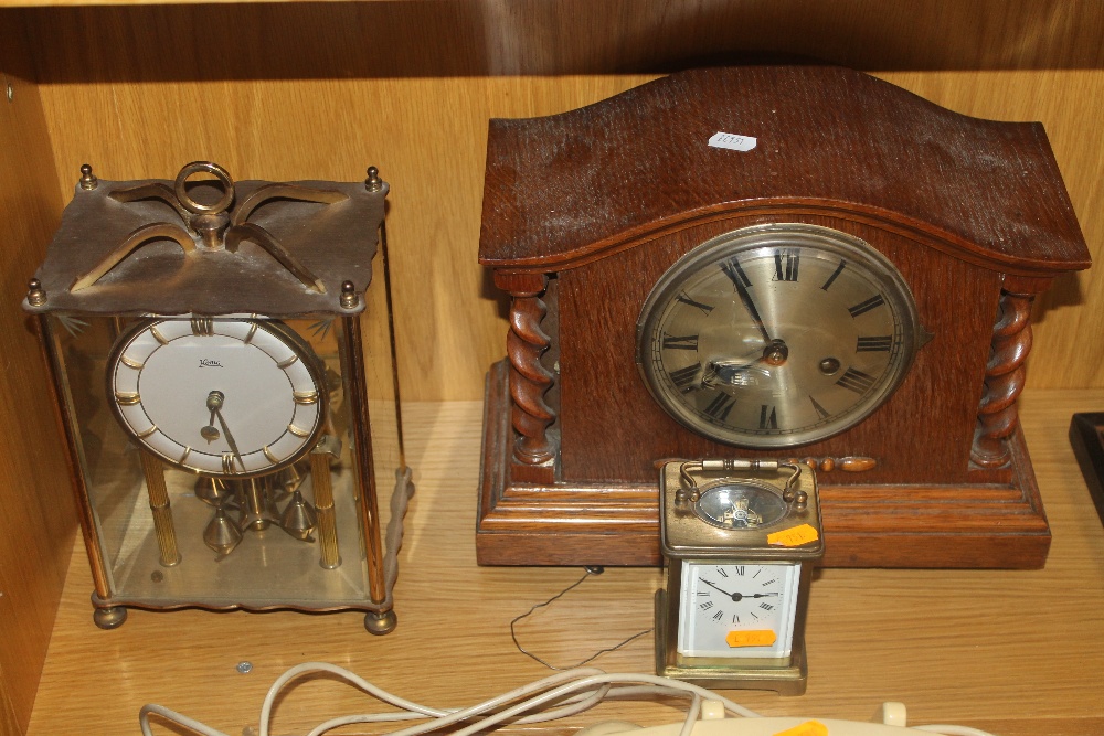AN OAK CASED MANTLE CLOCK TOGETHER WITH A SMALL CARRIAGE CLOCK AND ANOTHER