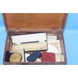 A VINTAGE SUITCASES CONTAINING A QUANTITY OF ASSORTED COSTUME JEWELLERY