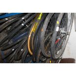 A QUANTITY OF ASSORTED BIKE WHEELS AND TYRES