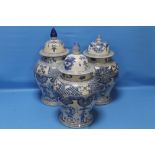 THREE LARGE ORIENTAL STYLE LIDDED JARS