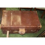 A LARGE VINTAGE LEATHER SUITCASE