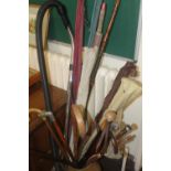 QUANTITY OF ASSORTED WALKING CANES, FISHING RODS ETC