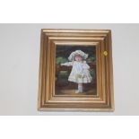 AN OIL ON CANVAS OF A CHILD IN A GILT FRAME