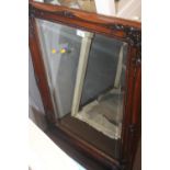 A LARGE FRAMED MODERN MIRROR