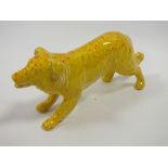 A SIGNED ANITA HARRIS ART POTTERY YELLOW DOG FIGURE