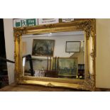 A MODERN HEAVY GILT FRAMED MIRROR 82 X 112 cm