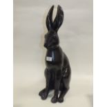 A MODERN METAL BRONZE EFFECT SEATED HARE FIGURE