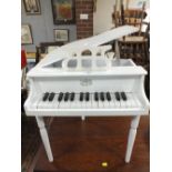 A MINIATURE WHITE BABY GRAND PIANO