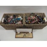 TWO BASKETS OF COSTUME JEWELLERY