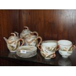 AN ORIENTAL EGGSHELL TEASET WITH DRAGON FINIALS