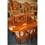 A YEW WOOD TWIN PEDESTAL DINING TABLE AND SIX CHAIRS