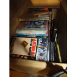 A BOX OF FOREIGN CDS AND DVDS ETC.