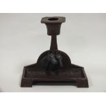 AN EQUESTRIAN INTEREST BRONZE ARTS AND CRAFTS STYLE CANDLESTICK WITH PEWTER HORSE HEAD DETAIL