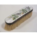 A HALLMARKED SILVER AND ENAMEL CLOTHES BRUSH