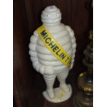 A LARGE MODERN CAST METAL MICHELIN MAN DOOR STOP