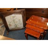 AN OAK FRAMED EMBROIDERED FIRE SCREEN H- 78CM PLUS A YEW NEST OF TABLES